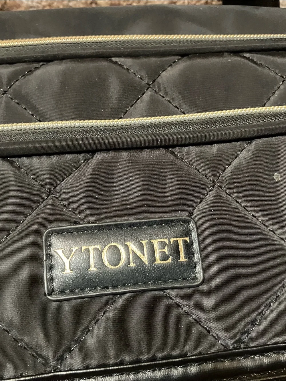 Quilted Black Rolling Travel Tote with Gold Accents